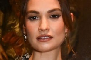 Lily James – Curly High Bun Updo (2023) – Vogue100 and Erdem Dinner